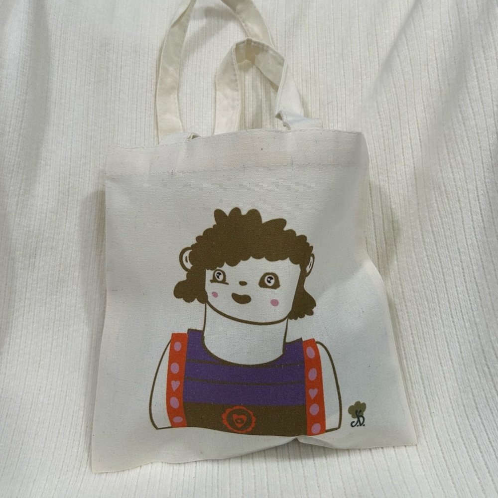 Cute cartoon canvas tote bag with original artwork.